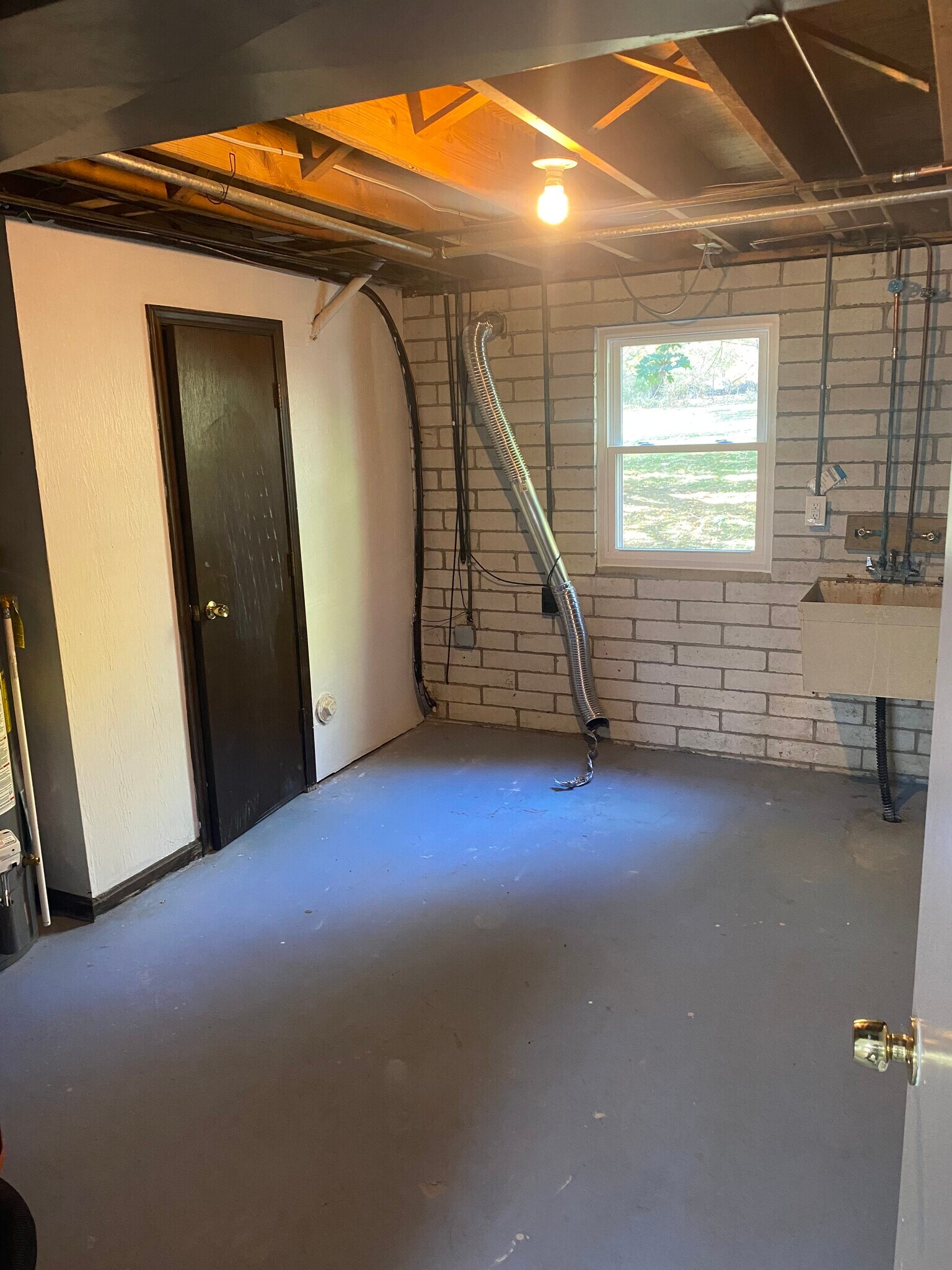 Utility room with half bath - 4472 King Arthur Dr