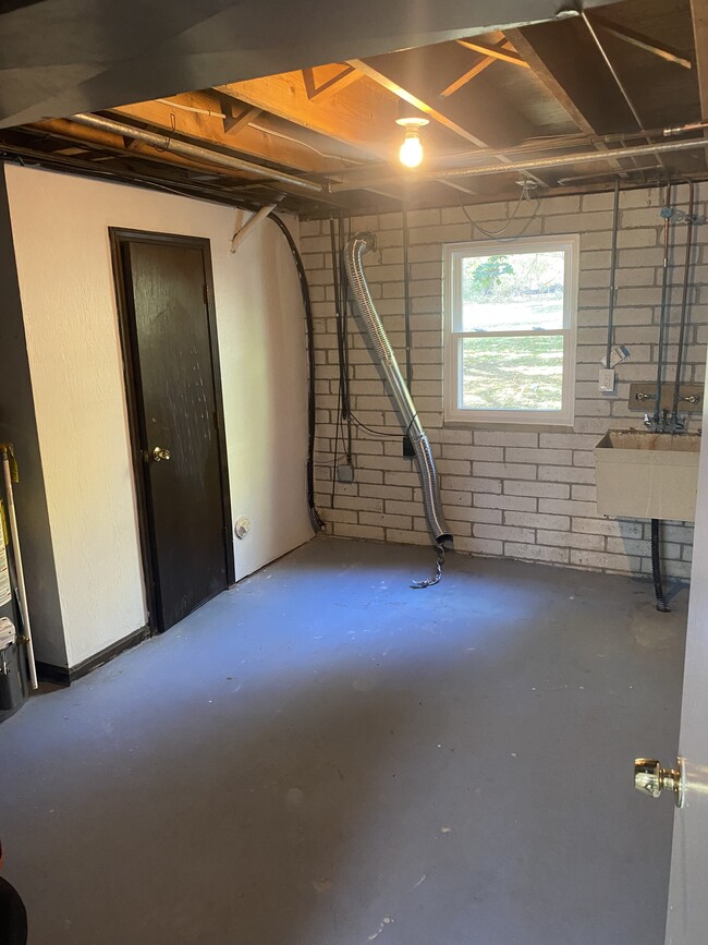 Utility room with half bath - 4472 King Arthur Dr