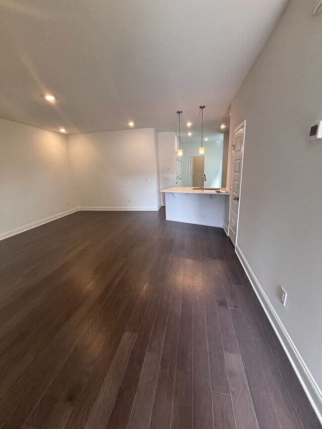 Building Photo - **BE THE LUCKY ONE TO LIVE IN THIS 2024-BUILT END-UNIT TOWNHOME IN A RESORT-STYLE COMMUNITY**
