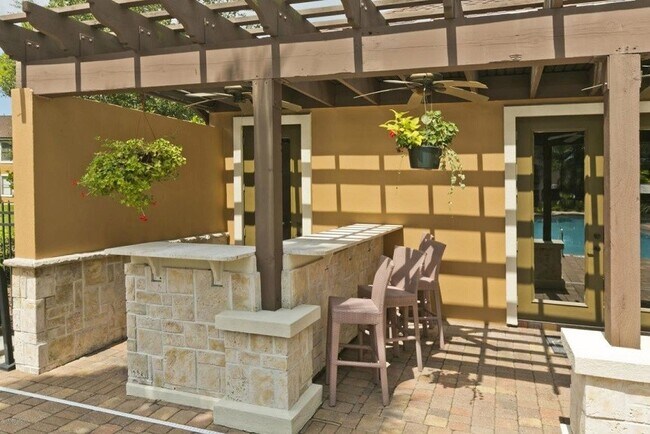 An outdoor bar is another resort-style amenity. - 100 Fairway Park Blvd