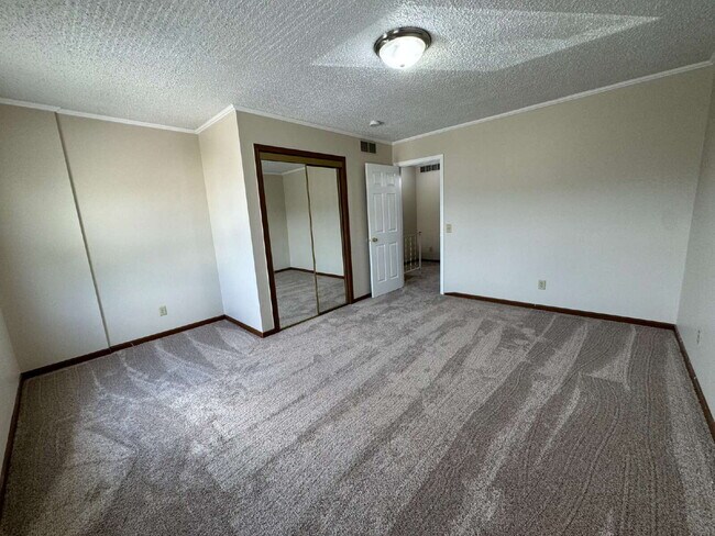 Building Photo - Love Grows — Spacious 2-Story Townhome