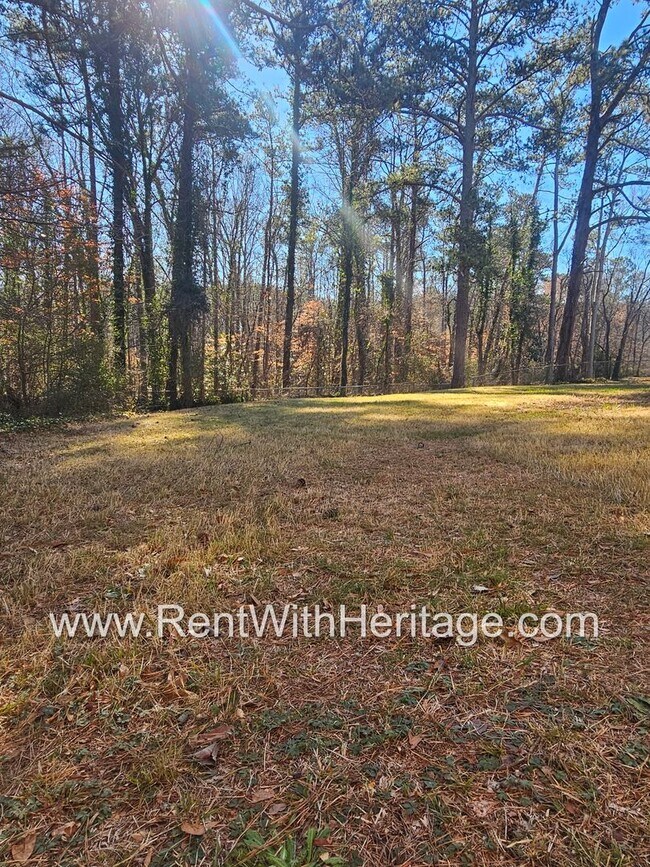 Building Photo - Great Brick Ranch / Harwood Floors / Huge Shop or Extra Storage / No Garage / Great Private Back ...