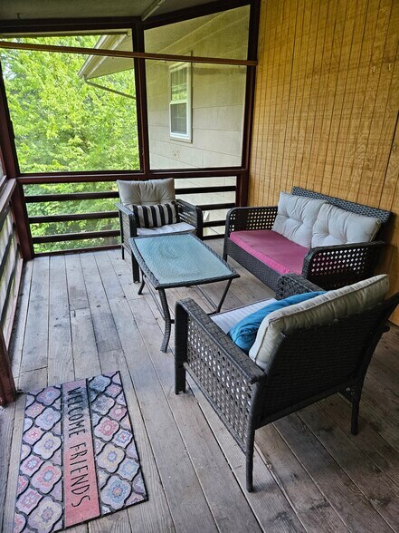 screened back patio with view of large backyard - 3 Morris Ln