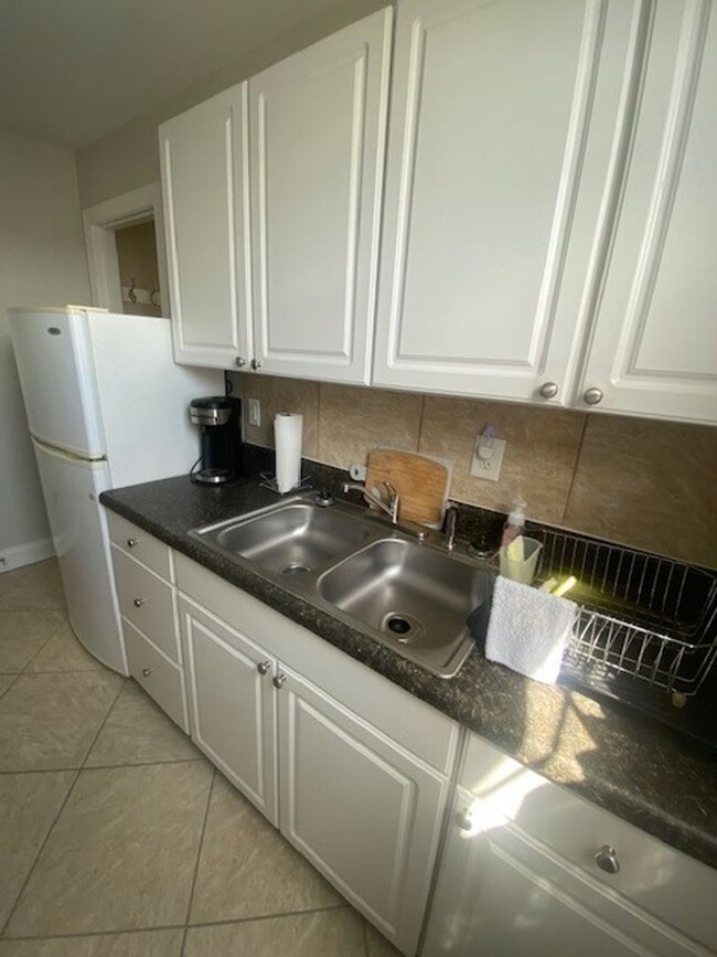 Building Photo - Nicely furnished garage apartment in gated...
