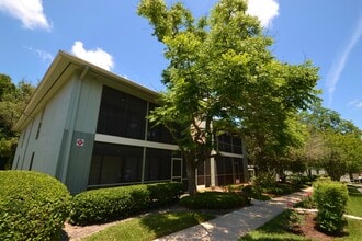Building Photo - Lovely Winter Springs Condo ~ Vinyl Plank Flooring and Large Screened Patio!