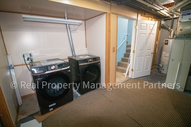 Building Photo - Forest Hills 3 Bed Townhome with Garage, Pond View and Some Utilities Included