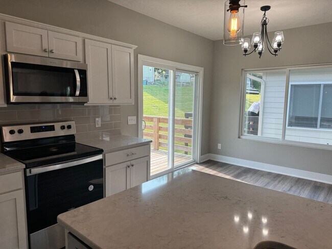Building Photo - Luxury Bennington Townhome Ready For Move In