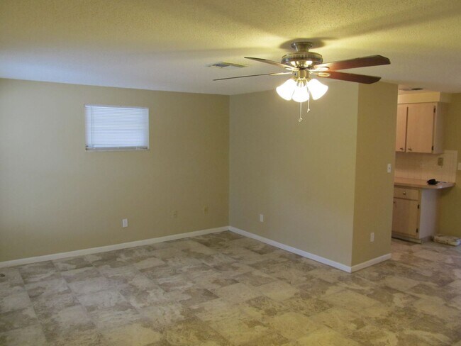 Building Photo - Three bedroom one and a half bathroom house with large yard space