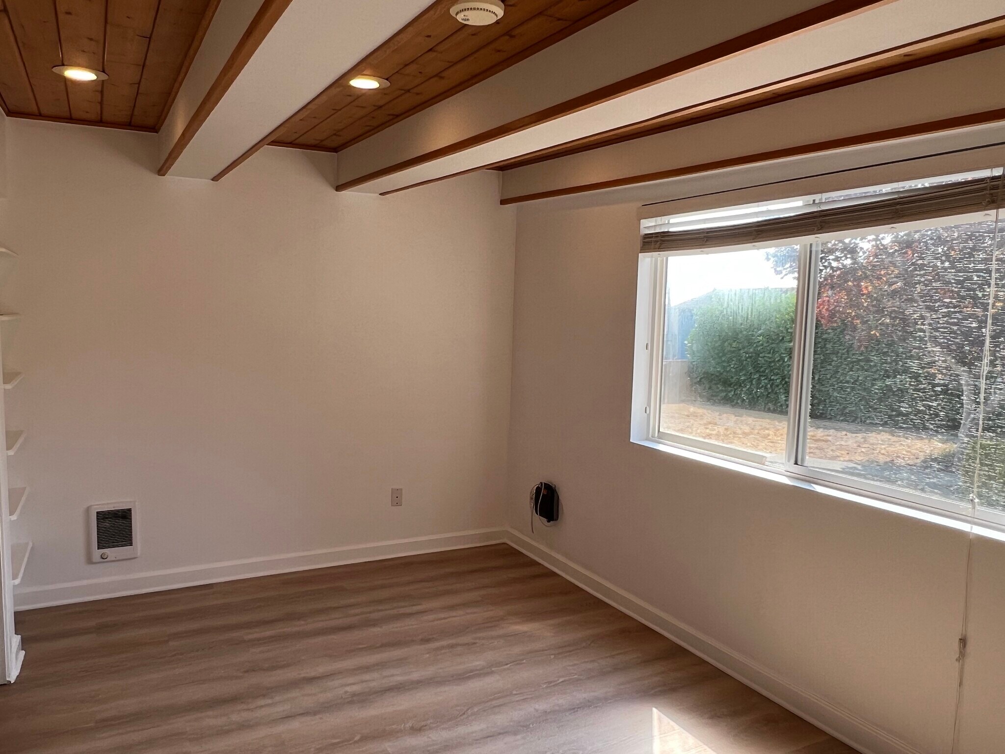 Main bedroom with knotty pine ceilings and stylish new flooring - 21204 3rd Ave S