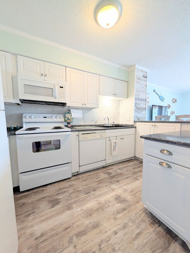 Building Photo - Dreamy Little River Condo — Furnished, Elevator Access, Pool & Marina Nearby!