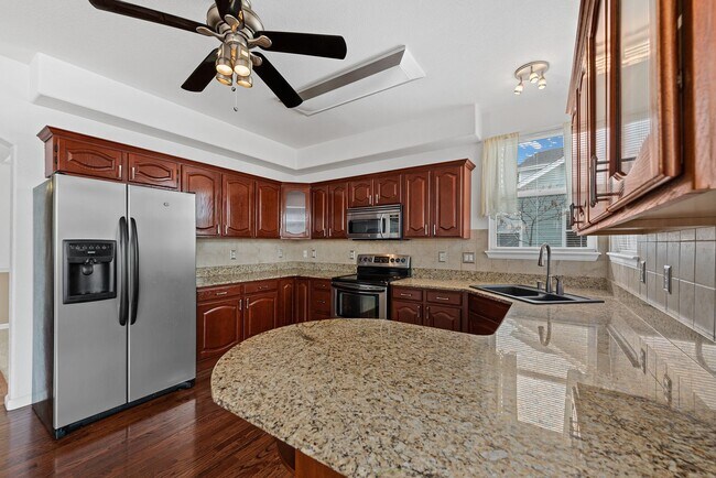 Building Photo - Long Realty & Property Management - Big home. Big yard. Big vibes. 6 beds 4 baths 3,556 sq ft Aur...