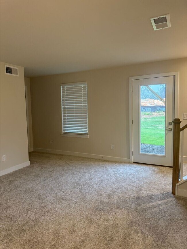 Building Photo - Brand New 3-Story Townhome with 2-Car Gara...