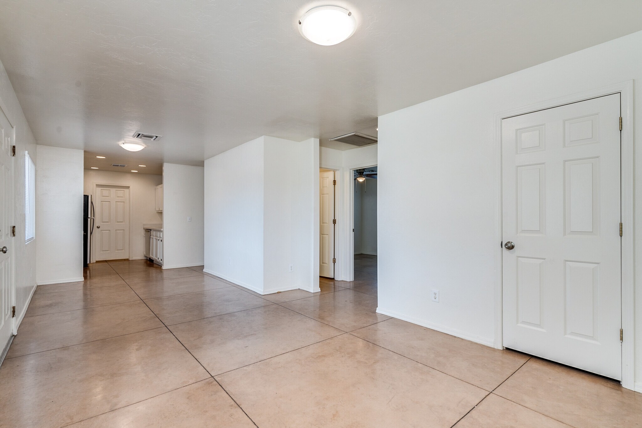 Open concept with living room and dining room leading to the kitchen - 3138 E Adams St