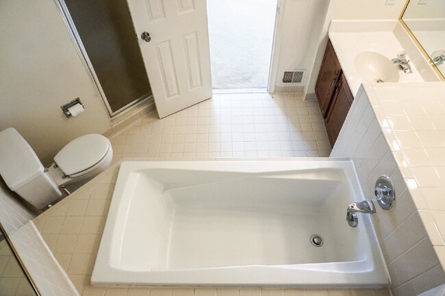 Building Photo - Beautiful brick townhome featuring three f...