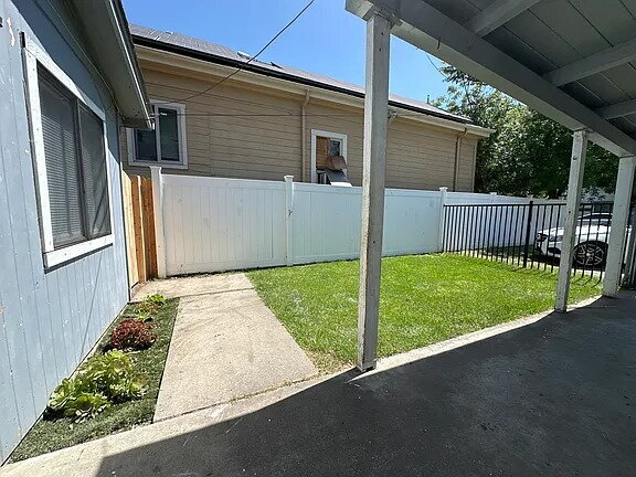 Building Photo - Fresh interior paint, new lighting fixtures, large living room, hall with laundry hook ups.