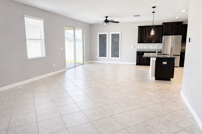 Building Photo - "Spacious 4-Bedroom Oasis with Modern Granite Touches in Land O' Lakes!"