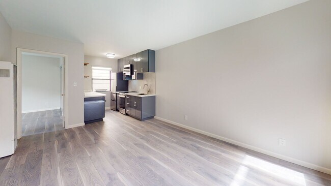 Building Photo - Remodeled modern 1 bedroom end unit, close...