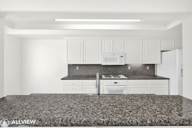 Building Photo - Spacious Coastal Condo with Rooftop Ocean ...