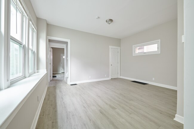 Spacious living room with an abundance of natural light and access to all bedrooms - 2354 Victor St