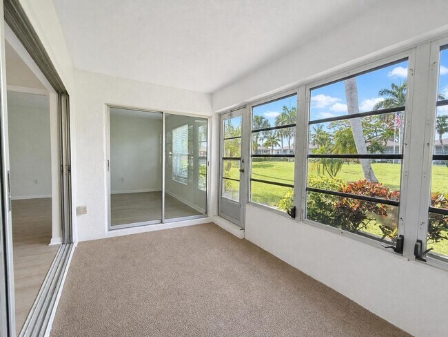 Building Photo - AVAILABLE NOW! Beautifully Renovated First-Floor Condo with Peaceful Screened Lanai