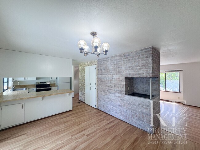 Building Photo - Spacious Poulsbo Home with Large Basement, Fenced Yard & Garden Space
