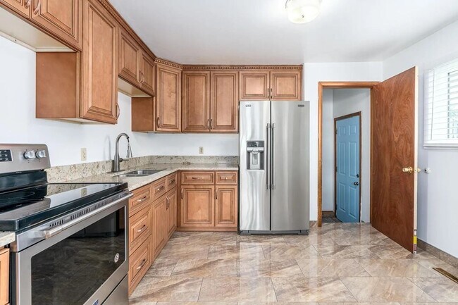 Building Photo - Beautiful 4-Bedroom Home with Finished Bas...