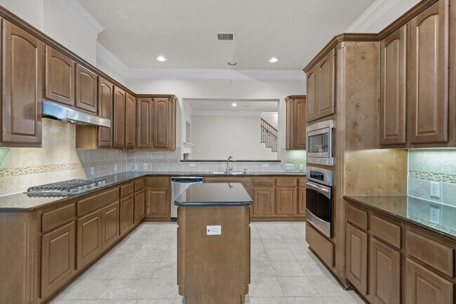 Building Photo - Luxury Townhome with Attached Garage & Outdoor Entertaining Area - $100 off first and second mont!