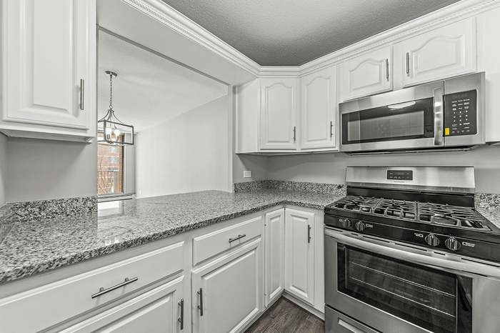 Kitchen to Dining Area - 2201 S Stewart Ave