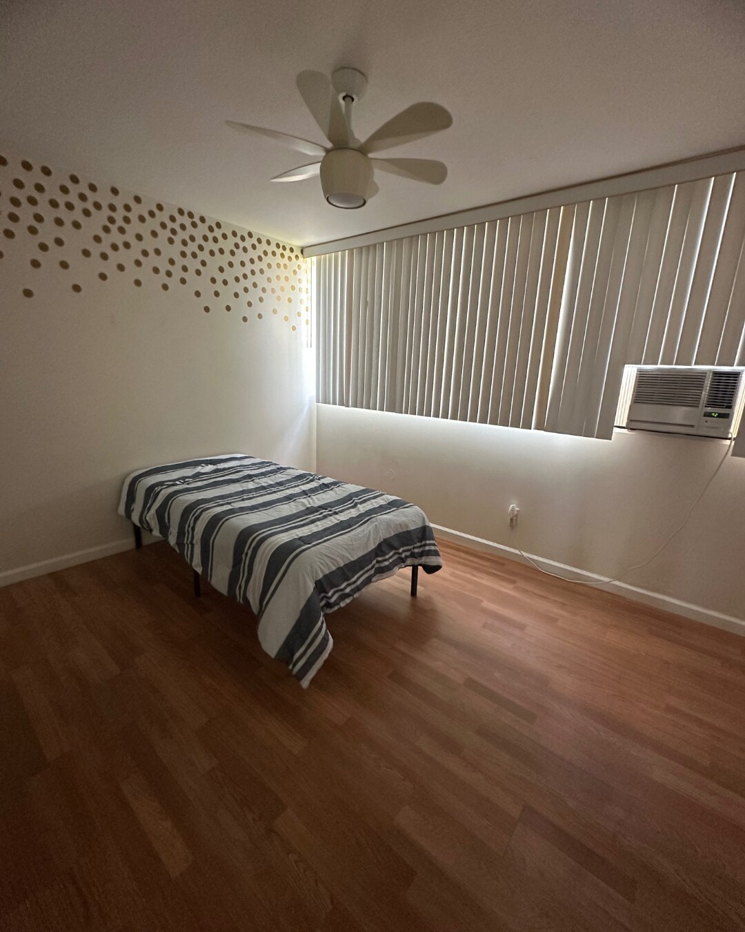 Bedroom 1 with Window AC, Ceiling Fan, and Mirrored Glass Sliding Door Closets - 1107 Acacia Rd