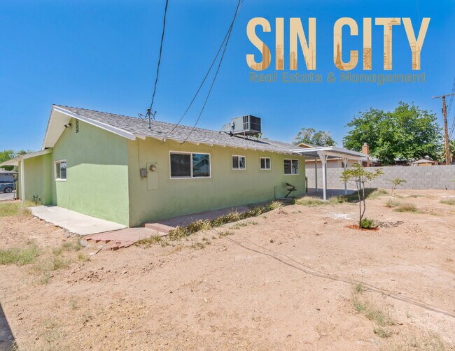 Building Photo - "Charming 4-Bedroom Retreat in Las Vegas –...