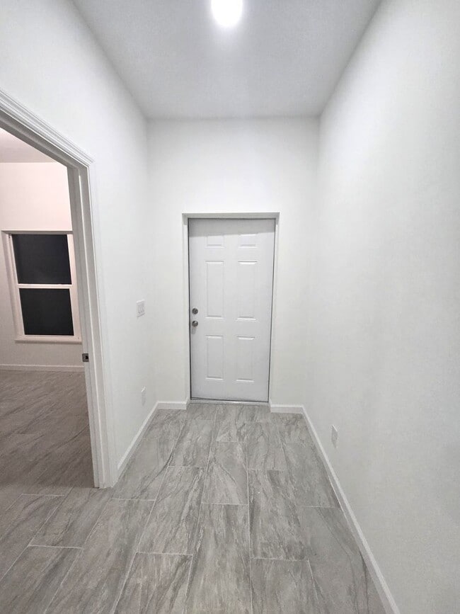 Building Photo - Brand-New 4BR/2BA Luxury Home with 2-Car Garage – Desirable 33971 Location