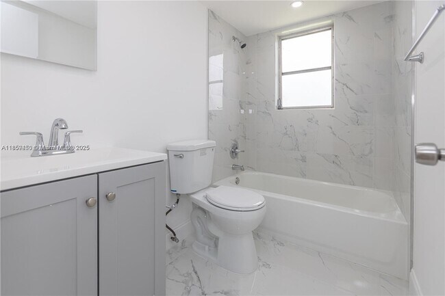 Building Photo - $2,100MONTHLY;8740 N SHERMAN CIR. #408 MIR...