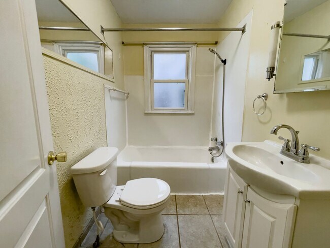 Building Photo - PRELEASING for AUGUST! Walk to Ball State! Bright 4BR Home with Fireplace