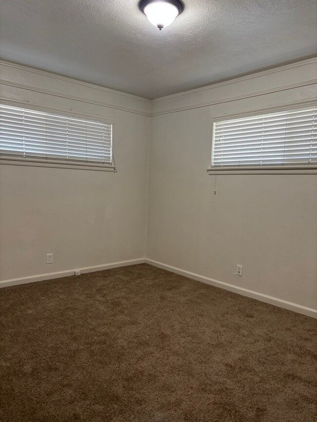 Building Photo - Updated 3 bedroom 2 bathroom home with large backyard, corner lot, close to shopping and schools ...