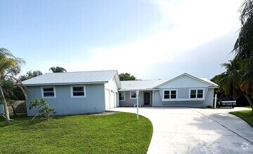 Building Photo - Boater's Dream: 4/2.5/3CG home in exclusiv...