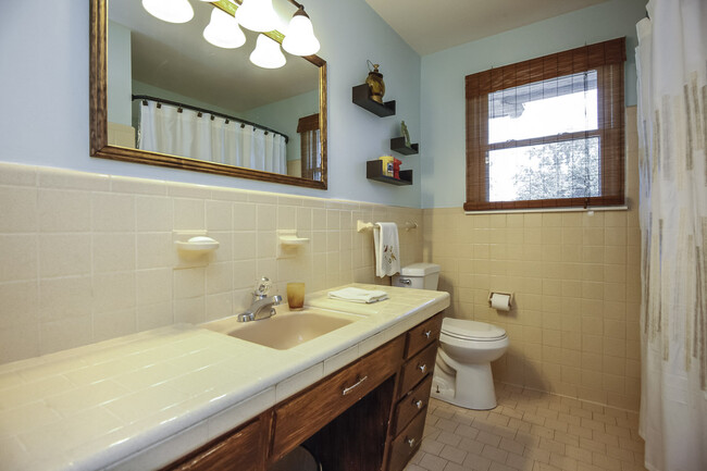 Photo 11. Master Bathroom upper level with tiled countertop, tiled floor and half walls - 1623 Lethia Dr