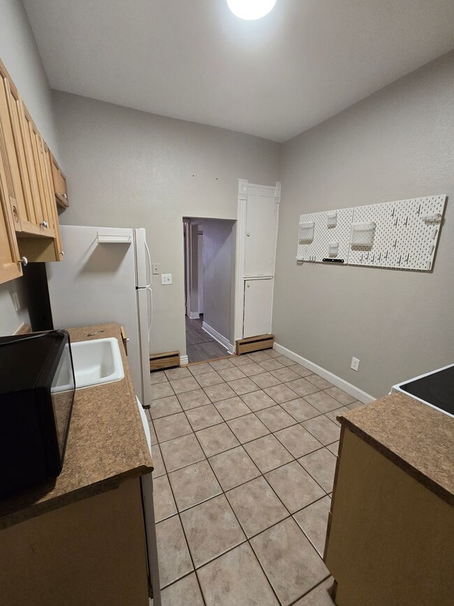 Building Photo - This updated and welcoming condo in the he...