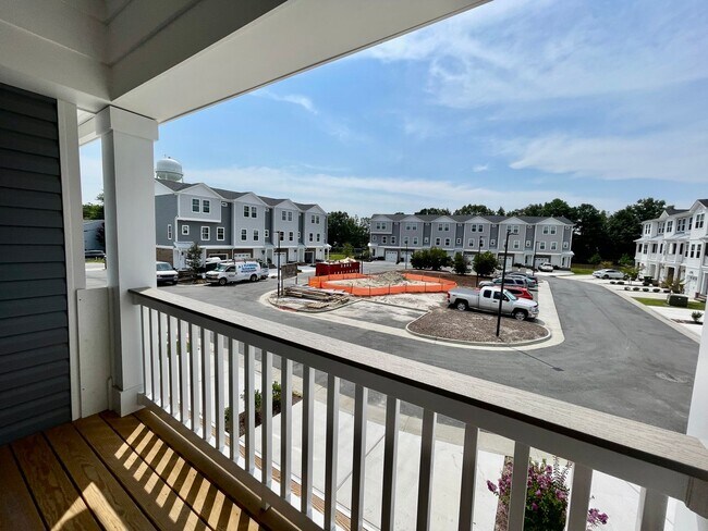 Building Photo - Practically New & Available NOW! Americana Luxury Townhomes! Pet Friendly! Attached Garage! All A...