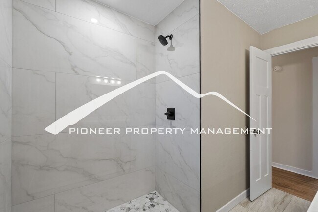 Building Photo - Beautifully Renovated Ranch Home with 2 Car Garage, AC, Garden Space & Prime Location