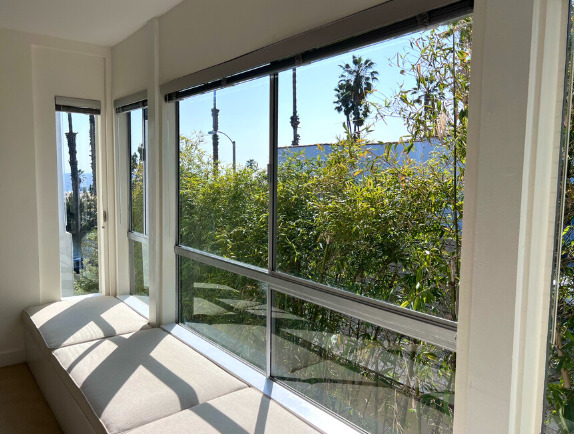 The window seat is the favorite lounging spot to enjoy side views of the ocean and beach. - 2221 Ocean Ave