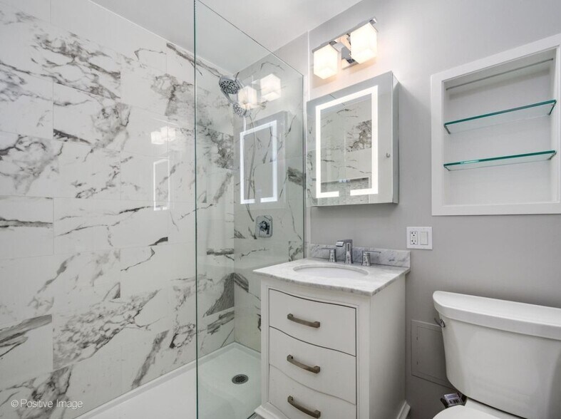 Custom tile bath with custom modern lighting and large tiled niche for all the bottles - 3100 N Lake Shore Dr