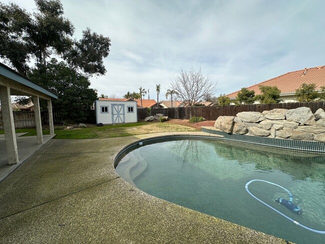 Building Photo - Spacious 4-Bedroom Rental with Pool & Hot ...