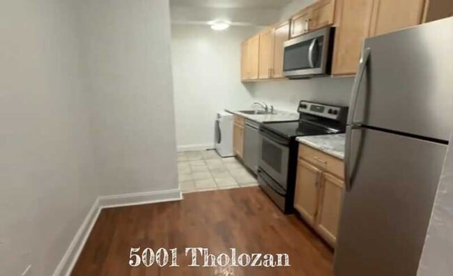 Building Photo - 5001 Tholozan Ave