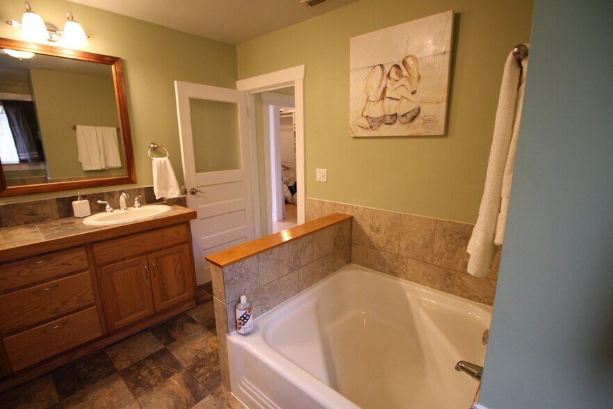 Large bathroom with cast iron tub, shower, double sinks - 1058 Central St SE
