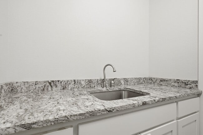 Building Photo - Stunner! This beautiful home features a spacious open floor plan with primary suite and private o...