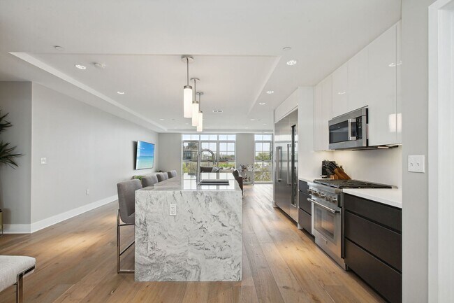 Building Photo - Elegant 2BR at The Adora | 1,500+ SF, Chef’s Kitchen & Garage Parking!