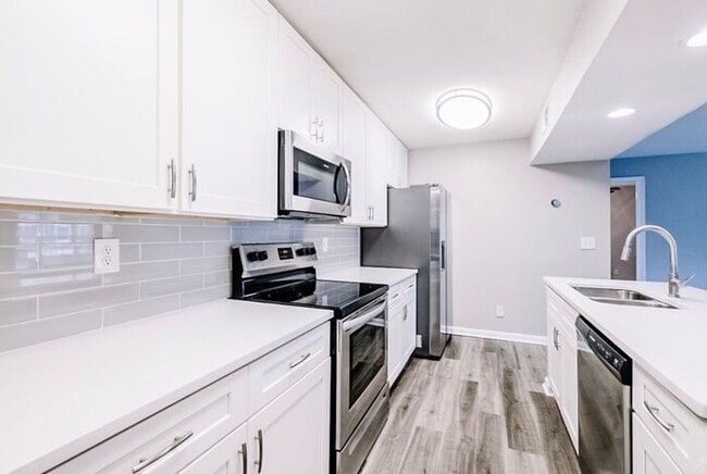 Building Photo - Spacious 2-Bedroom Elite Apartment with Private Balconies & Washer/Dryer