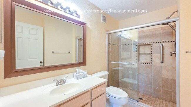 Building Photo - MOVE IN READY! LARGE 2 BEDROOM/2 BATH PLUS ATTACHED GARAGE! TILE/LVP THROUGHOUT!