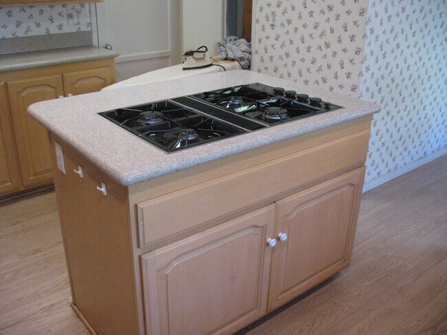 Kitchen island and ironing board built in (in background) - 3121 W Wyoming Ave