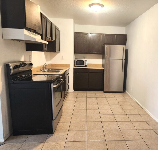 Building Photo - FIRST FLOOR LIVING WITH OPEN KITCHEN, DEN & CARPORT – GCU ACCESS